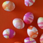 Watercolor easter eggs on a table.
