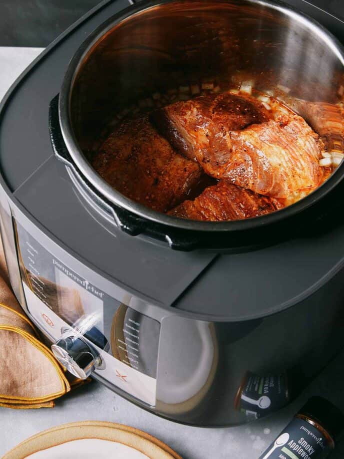 Pulled pork in a slow cooker.