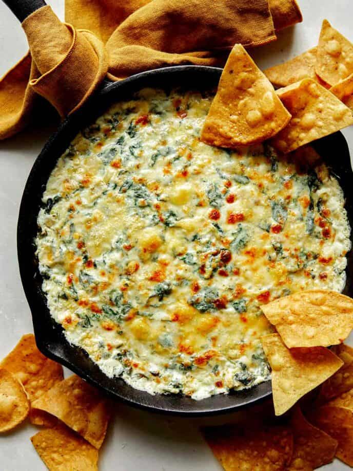 Spinach and artichoke dip in a skillet.