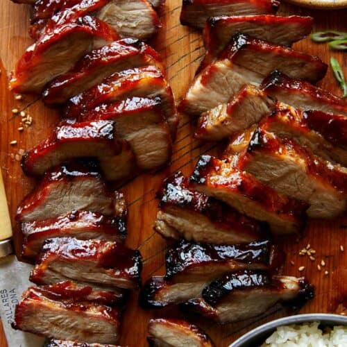 Char siu pork on a cutting board.