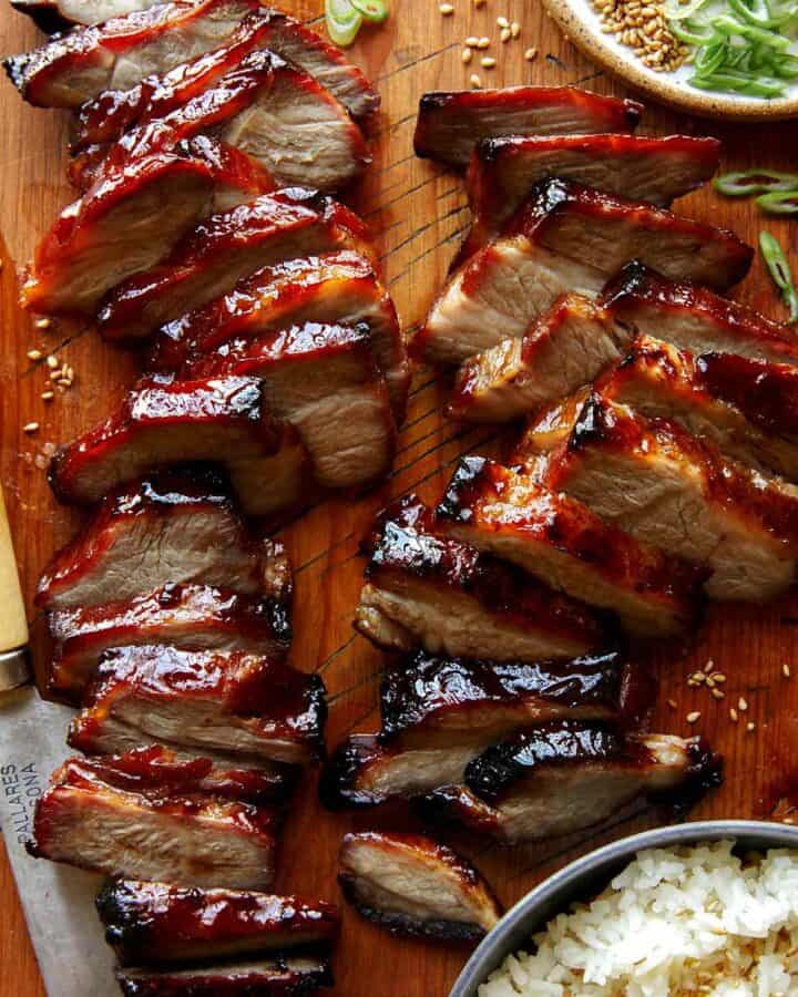 Char siu pork on a cutting board.