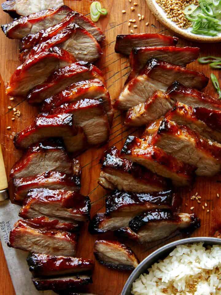 Char siu pork on a cutting board.