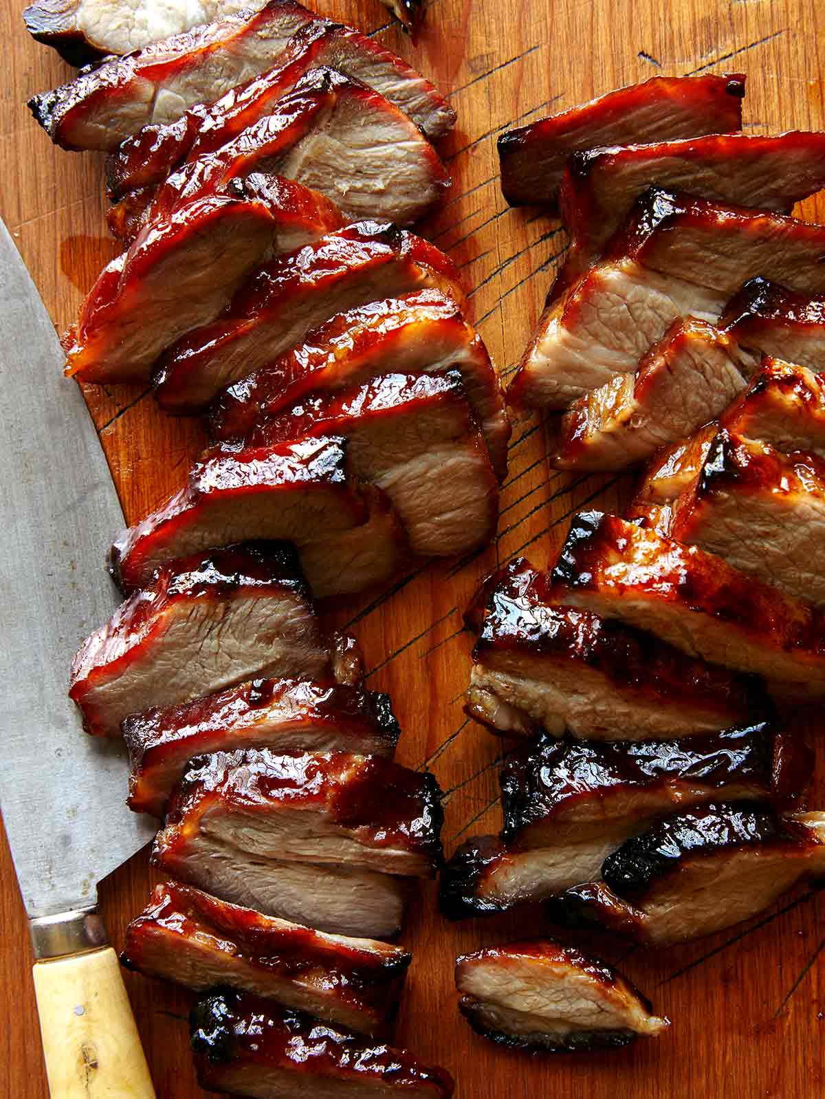 Char siu sliced on a cutting board. 