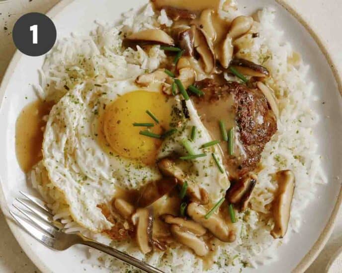 Finished loco moco recipe on a plate.