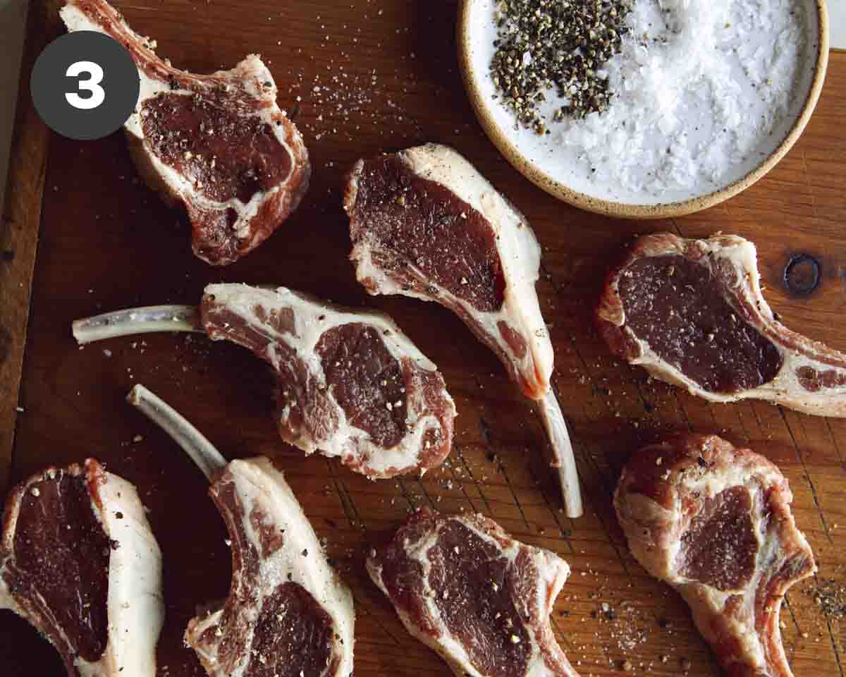 Lamb chops seasoned with salt and pepper. 