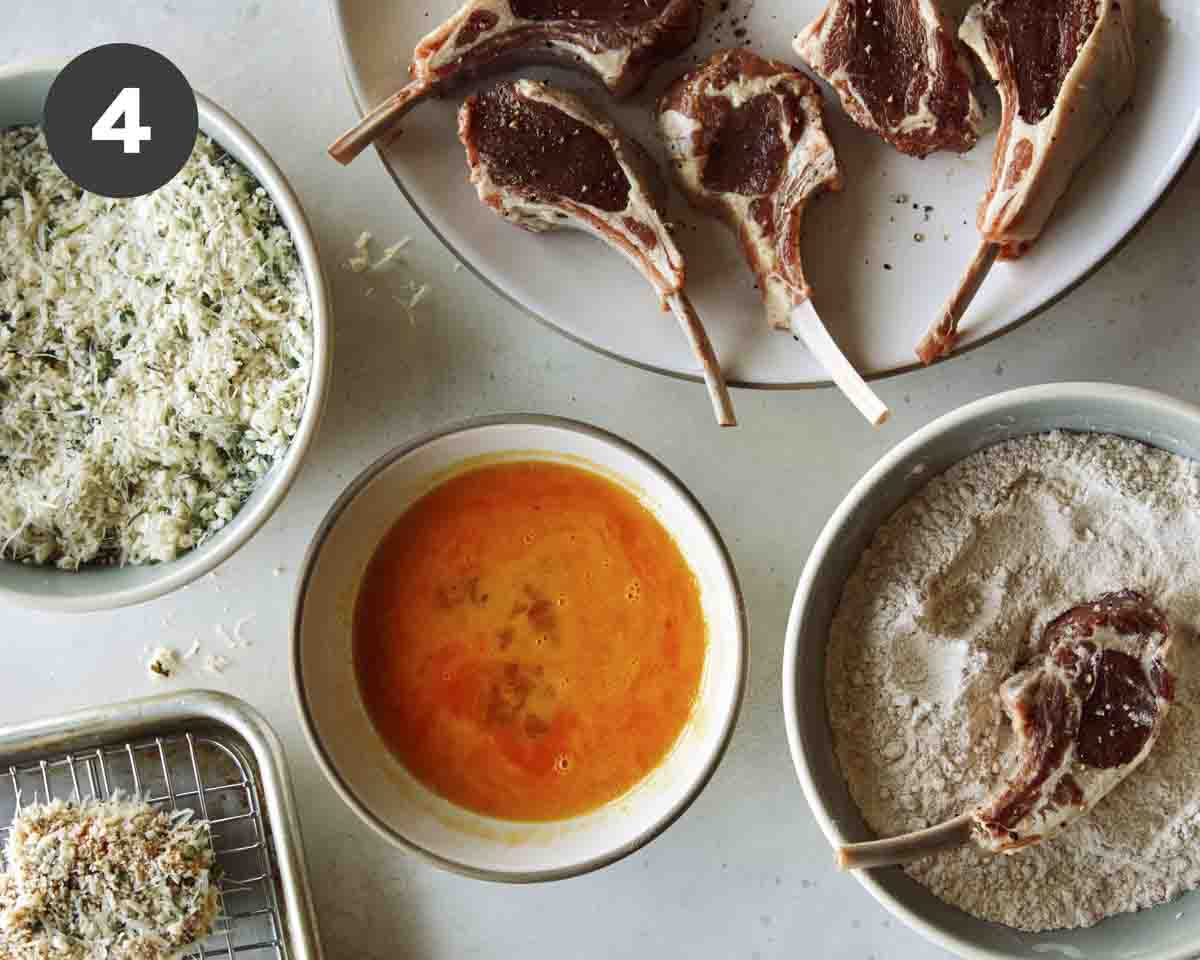 Lamb chops being dredged to pan fry.