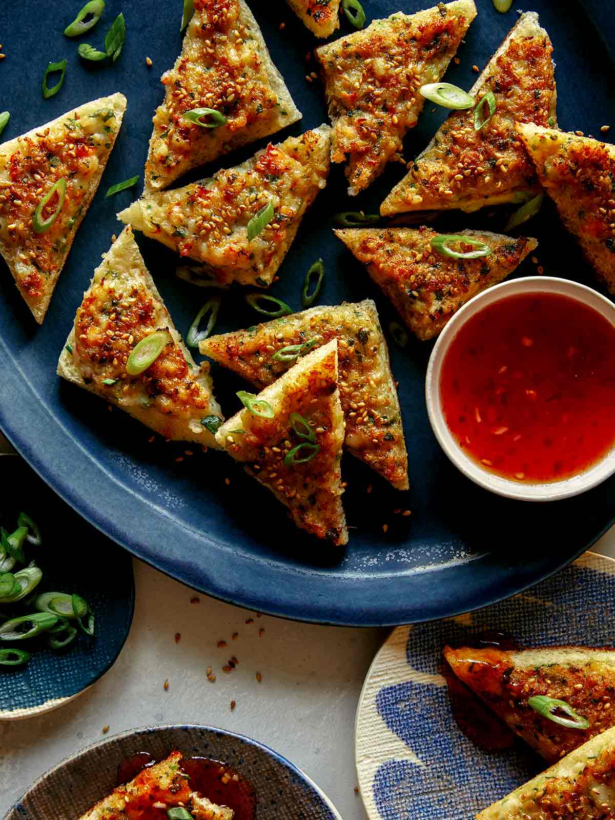 Shrimp toast being served as an appetizer. 