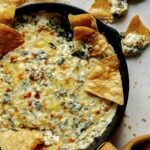 Spinach and artichoke dip in a skillet.
