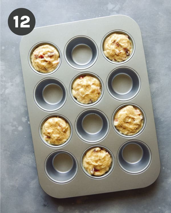 Muffins being baked in a tin.