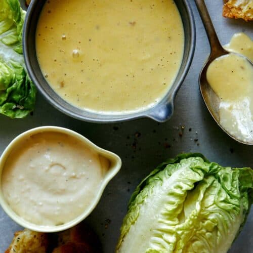 Caesar salad dressing recipe with lettuce on the side.