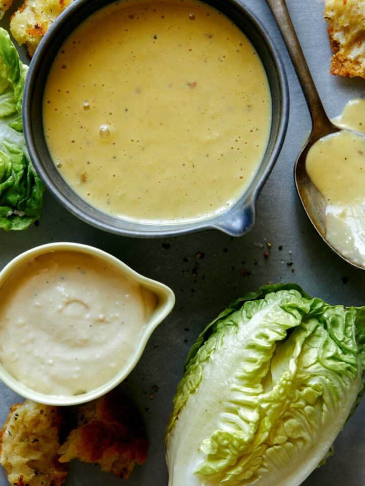 Caesar salad dressing recipe with lettuce on the side.