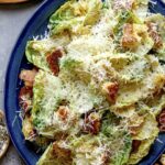 Close up on a platter full of caesar salad.