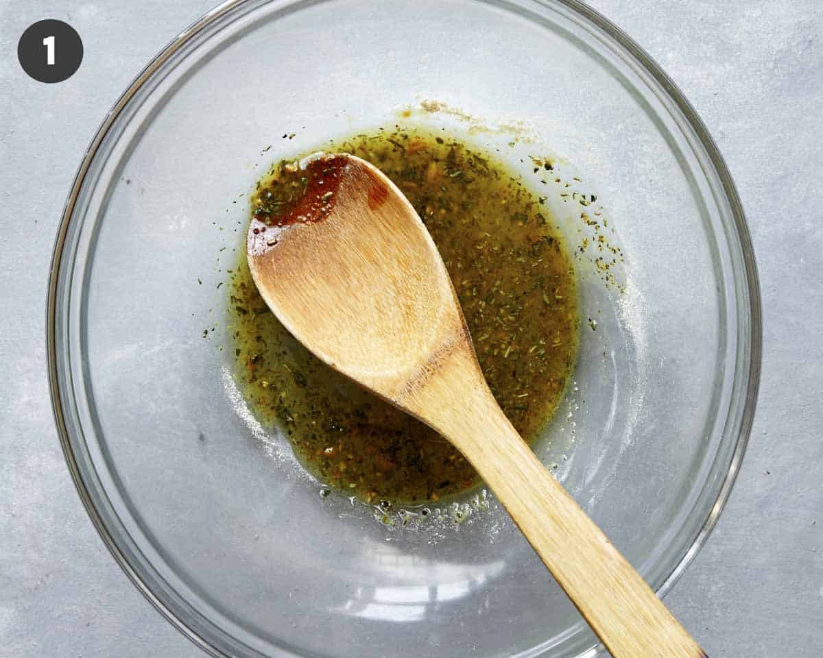 Crouton seasoned oil in a glass bowl.