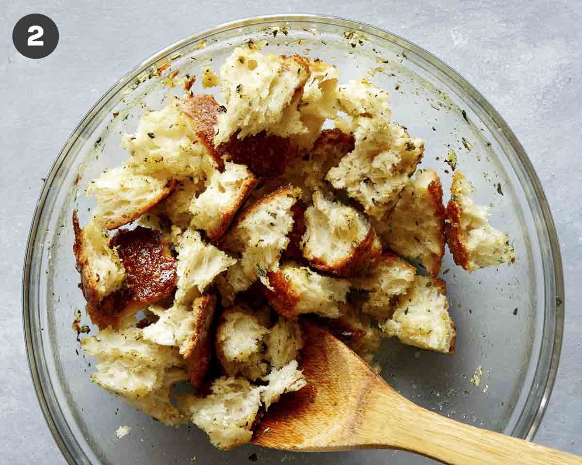 Torn bread croutons in a glass bowl.