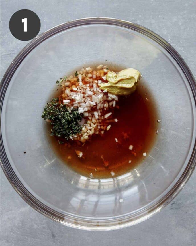 Red wine vinaigrette ingredients in a bowl.