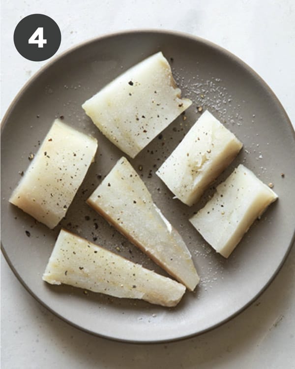 Seasoning cod pieces to make baja fish tacos.
