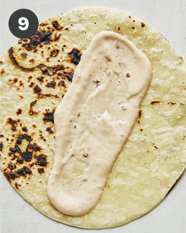 Making baja fish tacos with baja sauce.
