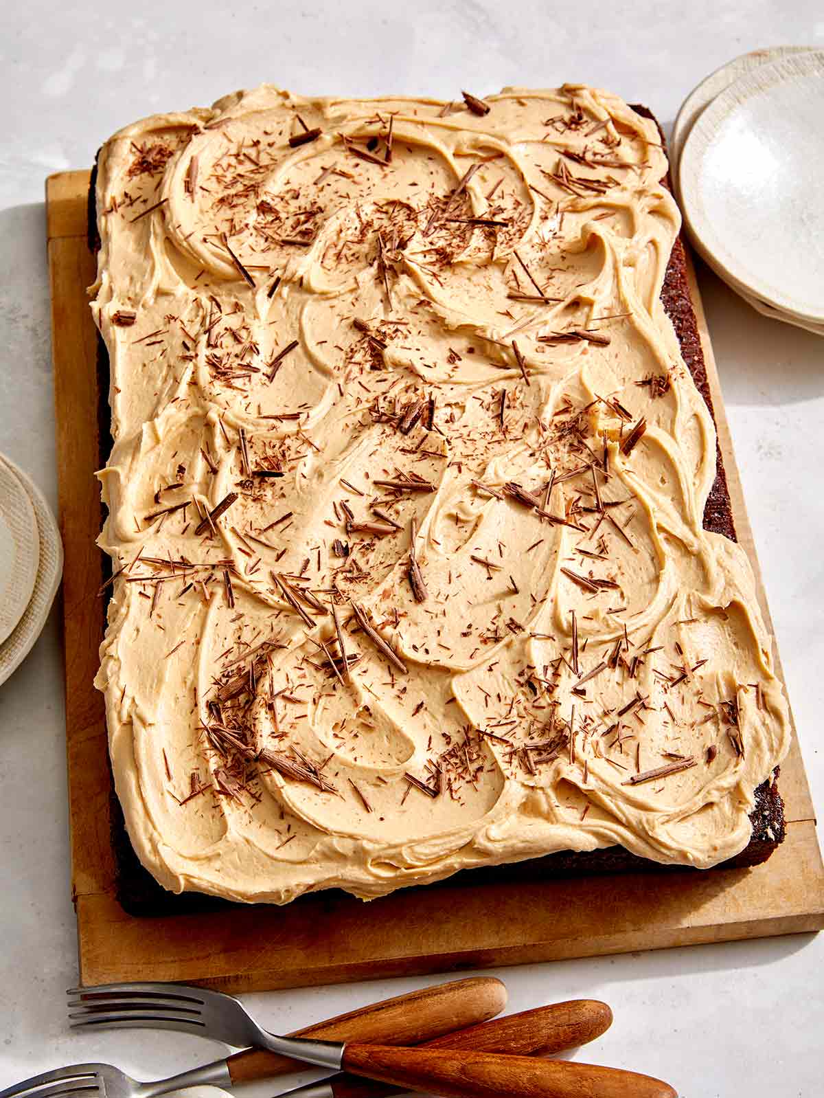 Chocolate sheet cake on a board. 