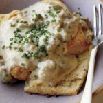 Biscuits and gravy in a bowl.