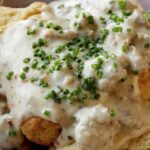 Biscuits and gravy in a bowl.