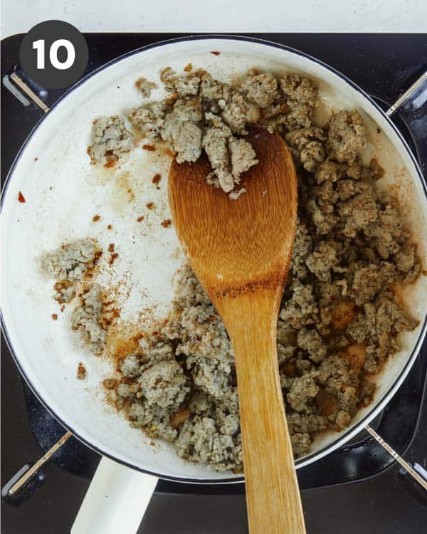 Pork sausage cooked in a skillet.