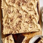 Chocolate sheet cake with peanut butter frosting on a board.