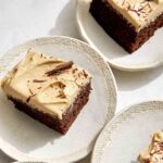 Slices of chocolate sheet cake with peanut butter frosting.