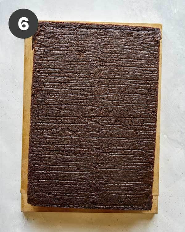 Chocolate cake turned out onto a board.