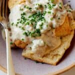 Biscuits and gravy recipe in a bowl with a fork on the side.