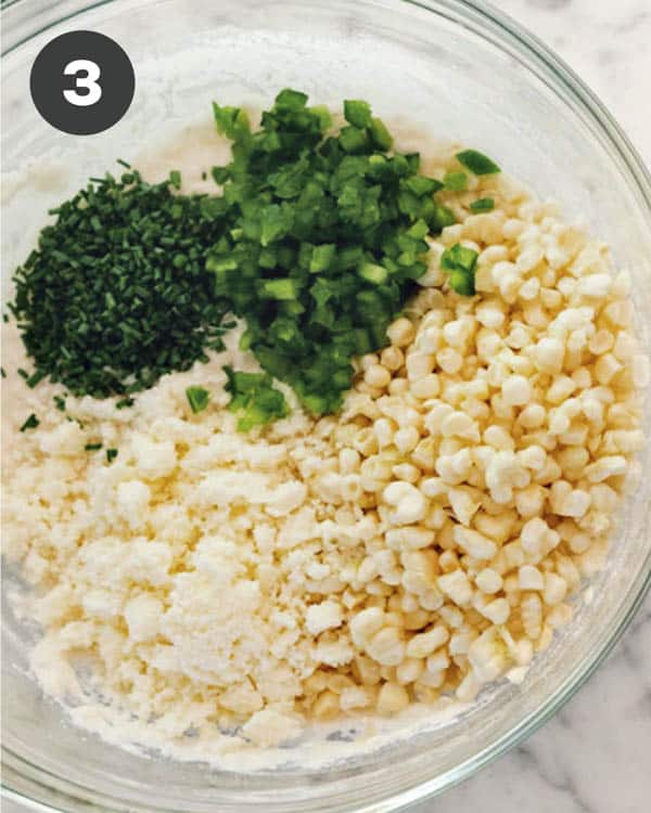 Corn. chives, and jalapeno in the bowl with a the other ingredients.