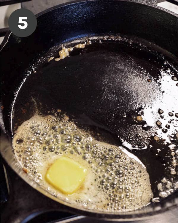 A close up of melting butter in a skillet.