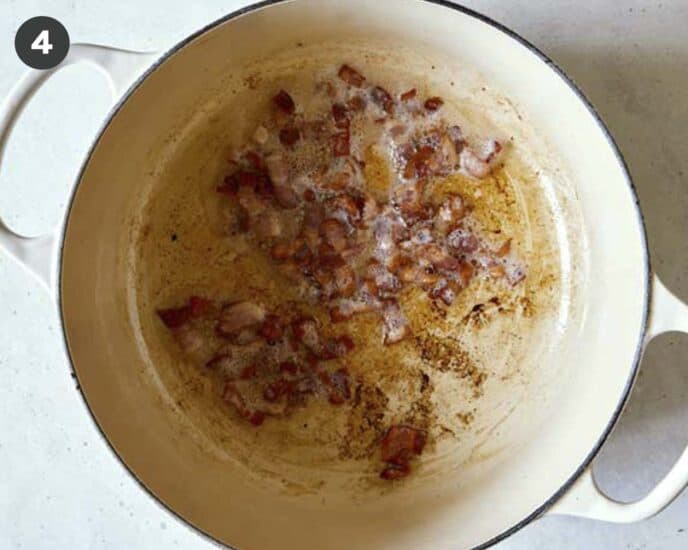 Pot with bacon rendered brown and crispy.