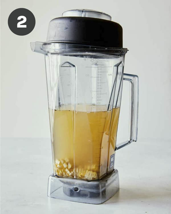 Corn in a blender with stock. 