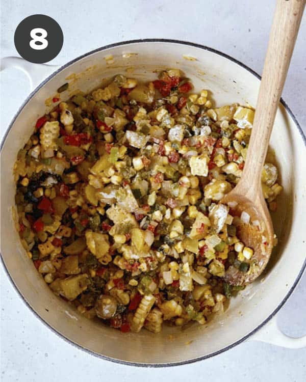 Corn chowder vegetables cooking in a pot. 