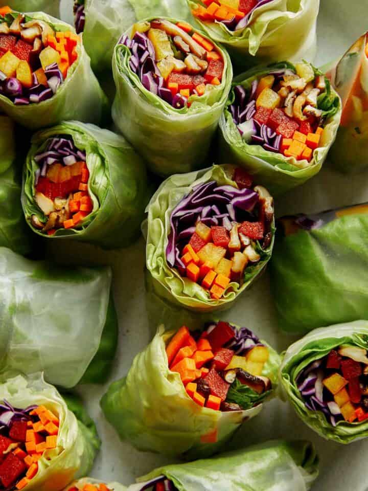 A platter full of fresh spring rolls.