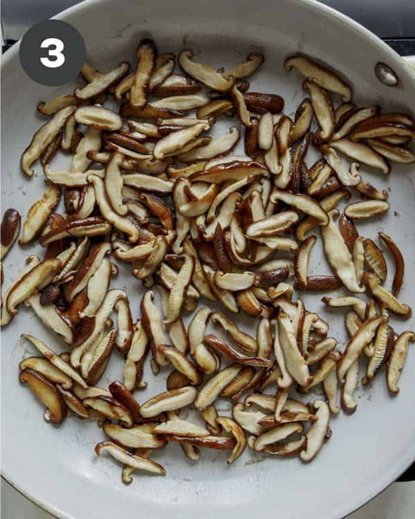 Mushrooms cooking in a skillet to make fresh spring rolls. 