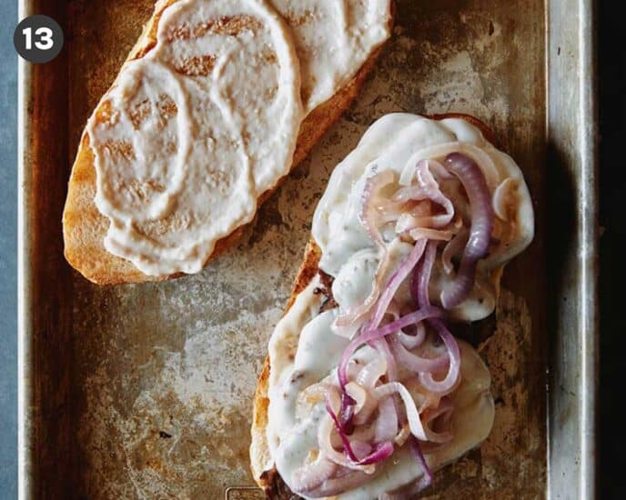 Grilled tri tip sandwich with caramelized onions on top.