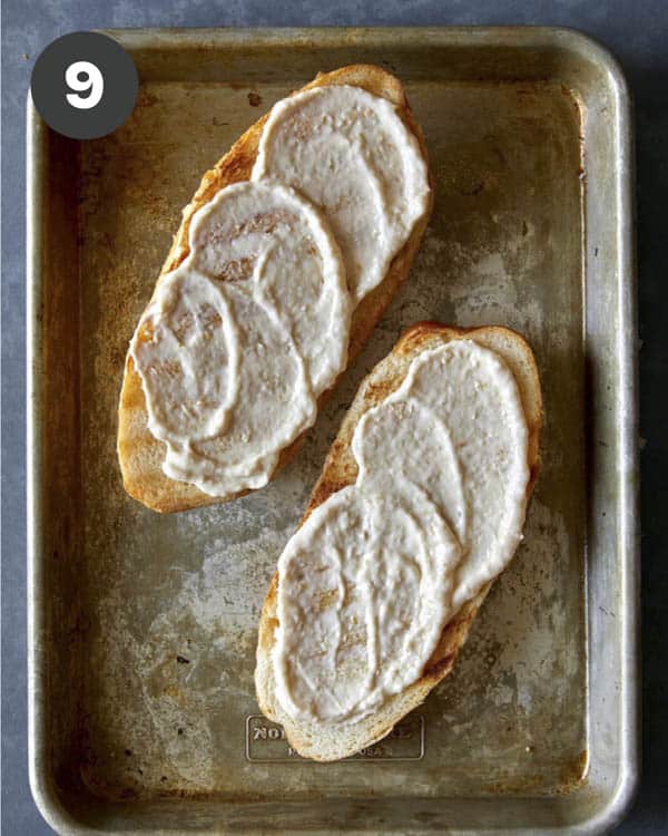 An open sandwich with mayo on both sides.