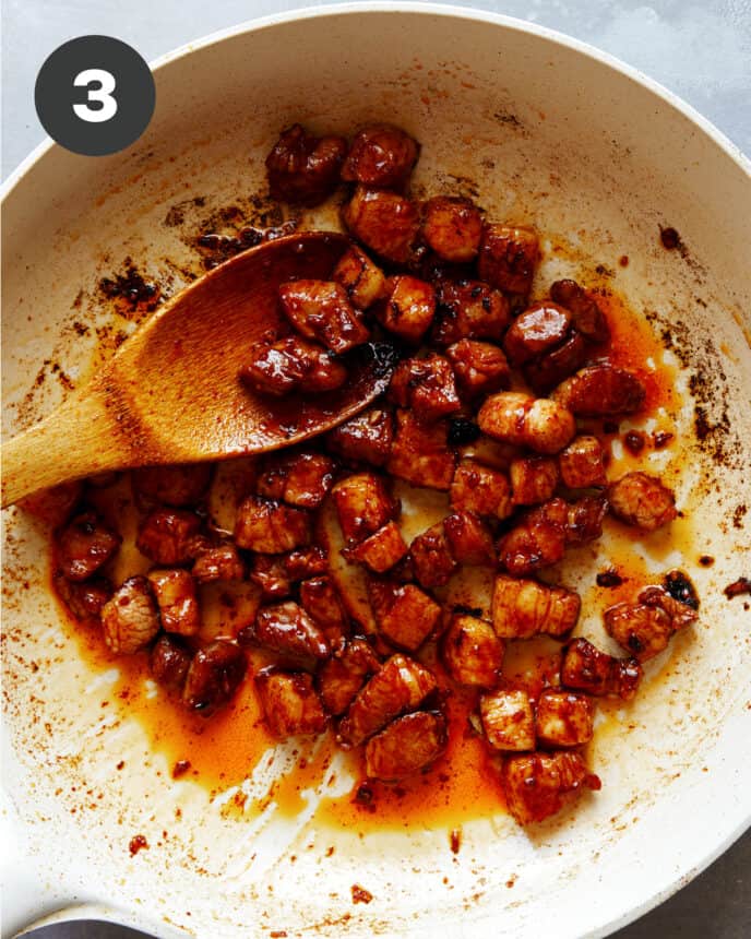 Pork belly cooked in a skillet. 