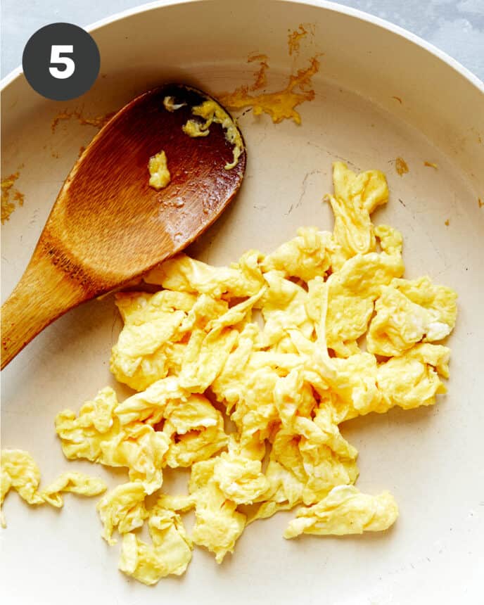 Scrambled eggs in a skillet.