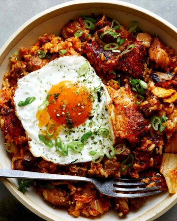 Kimchi fried rice in a bowl with a fried egg on top.