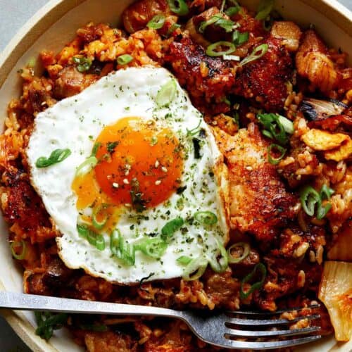 Kimchi fried rice in a bowl with a fried egg on top.