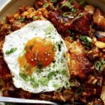 Kimchi fried rice in a bowl with a fried egg.