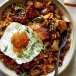 Kimchi fried rice in a bowl with a fried egg.