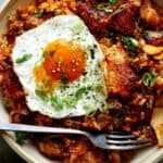 Kimchi fried rice in a bowl with a fried egg.