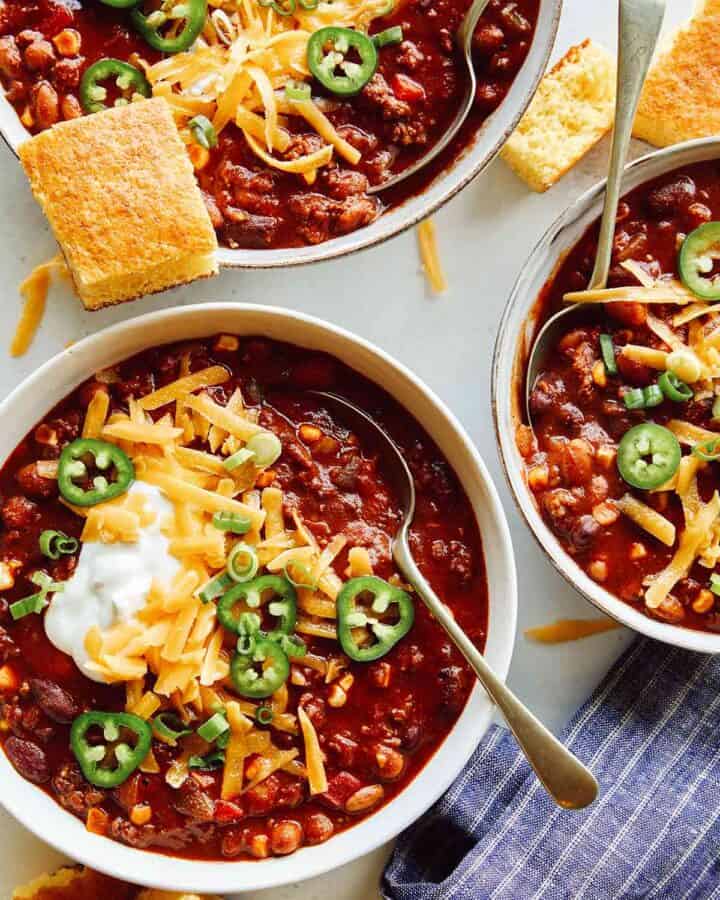 A recipe for kitchen sink chili in three bowls.