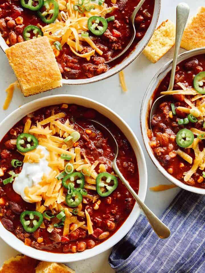 A recipe for kitchen sink chili in three bowls.