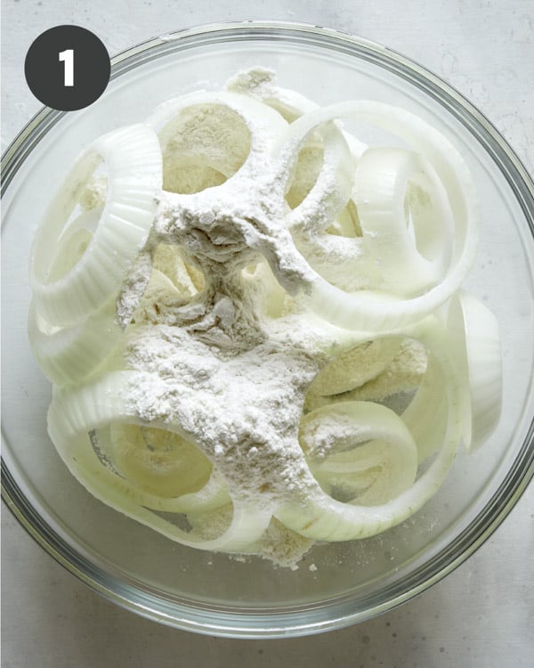 Onion ring slices tossed in flour.