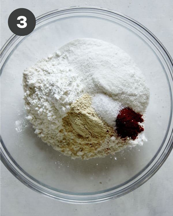 Dry ingredients in a bowl for beer battered onion rings.