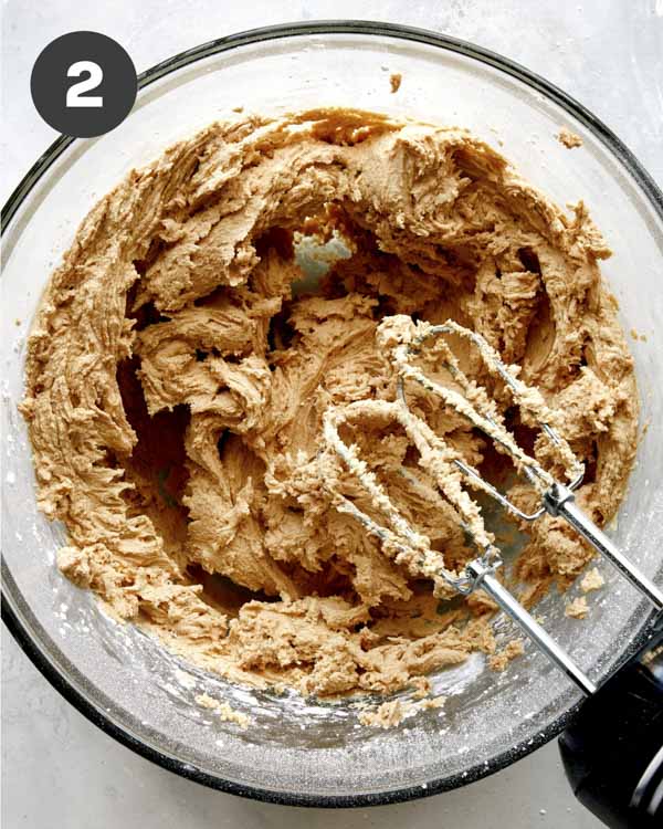 Creamed butter and peanut butter in a bowl to make peanut butter frosting.